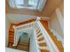 View of a wooden staircase with white railings at 3233 Osage St # 2A, Denver, CO 80211