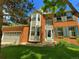 Charming two-story brick home with green shutters and a well-manicured lawn at 15292 E Hialeah Pl, Aurora, CO 80015