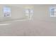 Bright, spacious bedroom with plush carpeting and lots of natural light from multiple large windows at 968 Congress Pl, Elizabeth, CO 80107