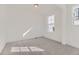 Cozy carpeted bedroom with natural light streaming in from two windows at 968 Congress Pl, Elizabeth, CO 80107