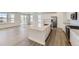 Stylish open kitchen with an island, modern appliances, and quartz countertops overlooking a dining area at 968 Congress Pl, Elizabeth, CO 80107