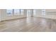 Bright living space with hardwood floors, natural light from large windows, and views of the outdoors at 968 Congress Pl, Elizabeth, CO 80107