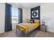 A bedroom designed with a space theme featuring a metal frame bed and decorative curtains at 22203 E 6Th Pl, Aurora, CO 80018