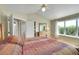Bright bedroom featuring a large window with wooded views and neutral decor at 20530 Parker Vista Cir, Parker, CO 80138