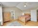 Spacious bedroom with wood floors, vaulted ceilings, ceiling fan, and ensuite bathroom at 20530 Parker Vista Cir, Parker, CO 80138