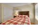 Comfortable bedroom with a large window, wood floors, and a closet for storage at 20530 Parker Vista Cir, Parker, CO 80138
