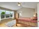 Bedroom featuring a large window, ceiling fan, and hardwood floors at 20530 Parker Vista Cir, Parker, CO 80138