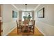 Elegant dining room with a round table, hardwood floors, and natural light for memorable meals at 20530 Parker Vista Cir, Parker, CO 80138