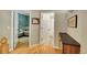 Hallway with hardwood floors, wall decor and views of other rooms at 20530 Parker Vista Cir, Parker, CO 80138