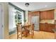 Cozy breakfast nook with a round table, surrounded by natural light and complemented by modern kitchen features at 20530 Parker Vista Cir, Parker, CO 80138