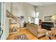Bright living room featuring high ceilings, hardwood floors, and a staircase, perfect for Gathering gatherings at 20530 Parker Vista Cir, Parker, CO 80138