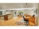 Spacious living room featuring hardwood floors, large windows, and comfortable seating area at 20530 Parker Vista Cir, Parker, CO 80138