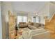 Cozy living room with hardwood floors and comfortable sofas, ideal for relaxing or entertaining guests at 20530 Parker Vista Cir, Parker, CO 80138