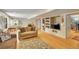 Open-concept living area with hardwood floors, built-in media center, and comfortable seating at 20530 Parker Vista Cir, Parker, CO 80138