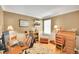 Well-lit home office space with a desk, bookshelves, and comfortable seating at 20530 Parker Vista Cir, Parker, CO 80138