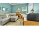 Cozy office with seating, bookcase, a window and wood floors at 20530 Parker Vista Cir, Parker, CO 80138