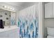 This bathroom features a decorative curtain, vanity, and mirror at 6743 Wild Rose Ln, Evergreen, CO 80439