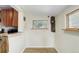 Dining area with natural light, wood-look floors, and rustic wood accents at 6743 Wild Rose Ln, Evergreen, CO 80439
