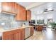 Open-concept kitchen with butcher block counters and seamless flow to the dining area at 6743 Wild Rose Ln, Evergreen, CO 80439