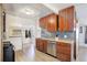 Spacious kitchen with wooden cabinets, stainless steel appliances, and ample counter space at 6743 Wild Rose Ln, Evergreen, CO 80439