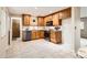Well-appointed kitchen with light wood cabinets, granite countertops, and stainless steel appliances at 798 Alkire St, Lakewood, CO 80401