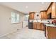 Updated kitchen featuring light wood cabinets, granite countertops, and stainless steel appliances at 798 Alkire St, Lakewood, CO 80401