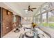 Bright sunroom with tiled floor, ceiling fan, skylight, and many windows at 798 Alkire St, Lakewood, CO 80401