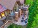 Aerial view of a home with stone terraces, fireplace, and fire pit at 41 Stillson Placer Ter, Breckenridge, CO 80424