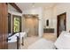 Luxurious bathroom features a freestanding tub, walk-in shower, and modern vanity with stone countertops at 41 Stillson Placer Ter, Breckenridge, CO 80424