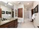 Well-lit bathroom with granite countertop vanity, and a separate bathtub and shower area at 41 Stillson Placer Ter, Breckenridge, CO 80424