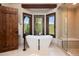 Stunning bathroom showcases a soaking tub, glass shower, and window views of the mountains at 41 Stillson Placer Ter, Breckenridge, CO 80424