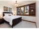 Comfortable bedroom with a large window showcasing a rock feature in the landscape at 41 Stillson Placer Ter, Breckenridge, CO 80424