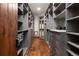Custom walk-in closet features built-in shelving, drawers, and ample storage space for organization at 41 Stillson Placer Ter, Breckenridge, CO 80424