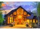 Grand entrance boasts a soaring gable, stonework, and warm lighting at 41 Stillson Placer Ter, Breckenridge, CO 80424