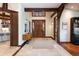Inviting foyer features stone floors, wood beams, and a decorative rug at 41 Stillson Placer Ter, Breckenridge, CO 80424