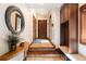 Hallway featuring tile floors, wood accents, custom shelving, and natural lighting at 41 Stillson Placer Ter, Breckenridge, CO 80424