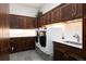 Well-equipped laundry room with front load washer and dryer and plenty of storage space at 41 Stillson Placer Ter, Breckenridge, CO 80424