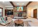 Cozy living room featuring a stone fireplace and built-in entertainment center at 41 Stillson Placer Ter, Breckenridge, CO 80424