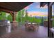 Outdoor deck with a built-in grill and seating, perfect for enjoying mountain views at 41 Stillson Placer Ter, Breckenridge, CO 80424