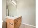 A modern bathroom with an expansive mirror and stylish lighting at 14211 E 1St Dr # 308, Aurora, CO 80011