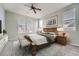 Well-lit bedroom featuring a large bed, two windows with blinds, and neutral wall color at 14211 E 1St Dr # 308, Aurora, CO 80011