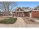 Exterior of the community clubhouse, featuring brick accents and well-maintained landscaping at 14211 E 1St Dr # 308, Aurora, CO 80011