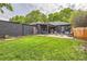 Spacious backyard with lush lawn, charming patio, and inviting outdoor seating area at 900 Locust St, Denver, CO 80220