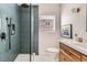 Bathroom featuring blue tile and modern fixtures at 900 Locust St, Denver, CO 80220