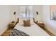 Bedroom featuring a queen bed with two side tables and wood floors at 900 Locust St, Denver, CO 80220