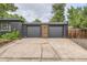 Two car garage with a brick exterior and decorative wooden accent at 900 Locust St, Denver, CO 80220
