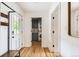 Bright hallway with hardwood floors, laundry area, and convenient access to a pet door at 900 Locust St, Denver, CO 80220