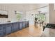 Bright kitchen featuring shaker cabinets, marble countertops, and hardwood floors at 900 Locust St, Denver, CO 80220