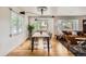 Dining area open to living area with many windows and lots of natural light at 900 Locust St, Denver, CO 80220