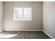 Neutral bedroom with a large window letting in lots of natural light and plush carpet flooring throughout at 2741 Sunset Way, Erie, CO 80516